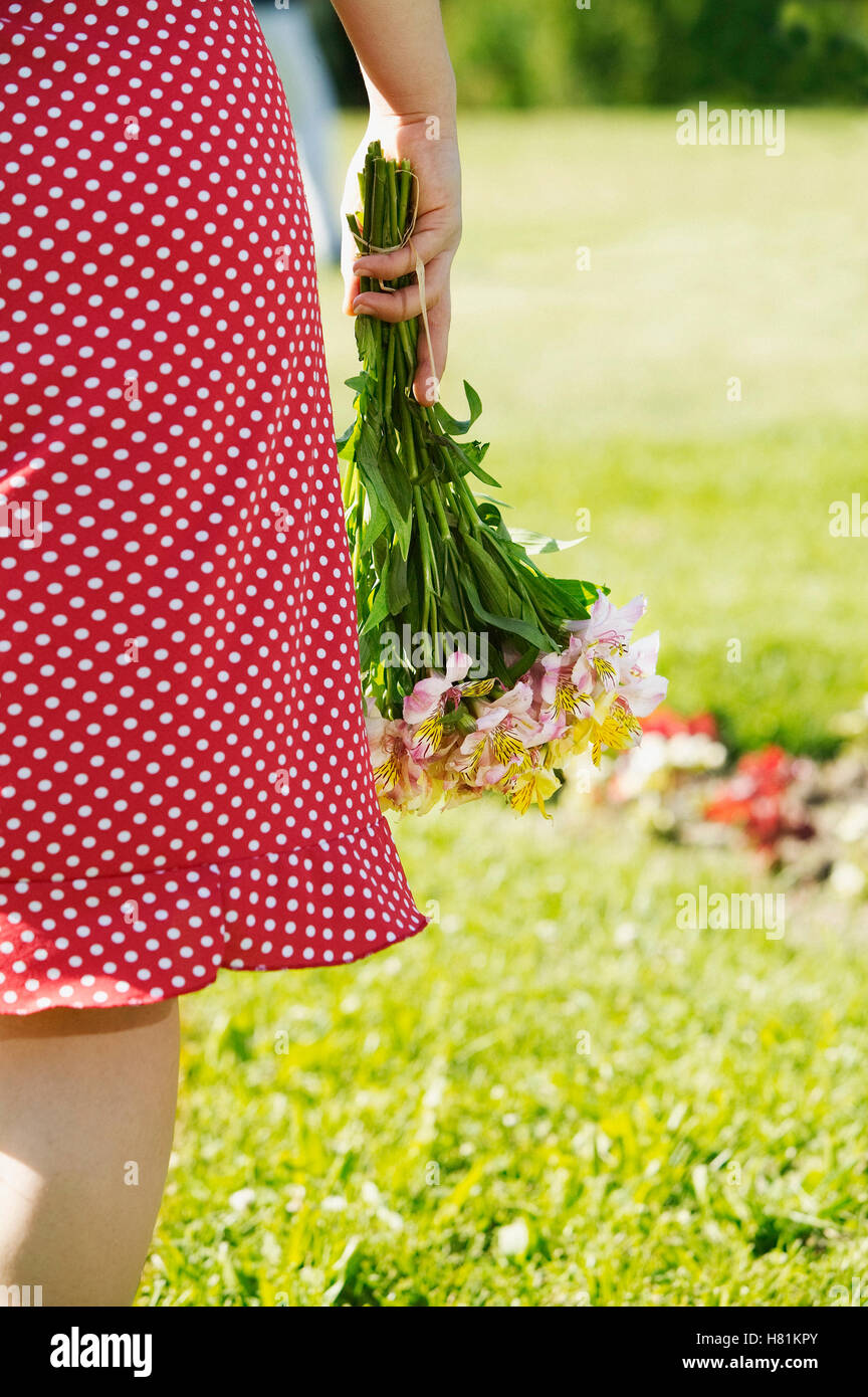 woman holding flowers Stock Photo