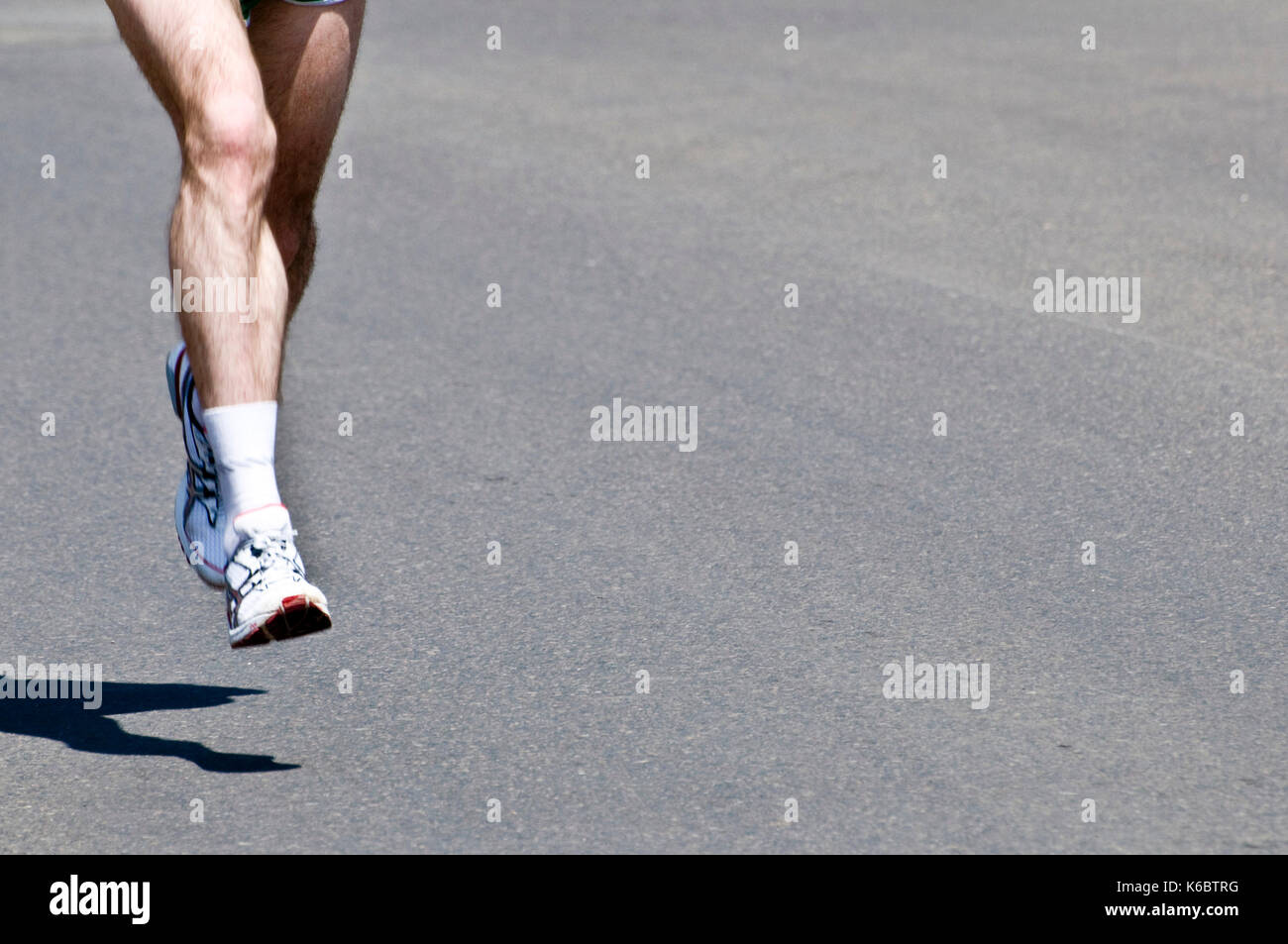 legs of a marathon runner Stock Photo