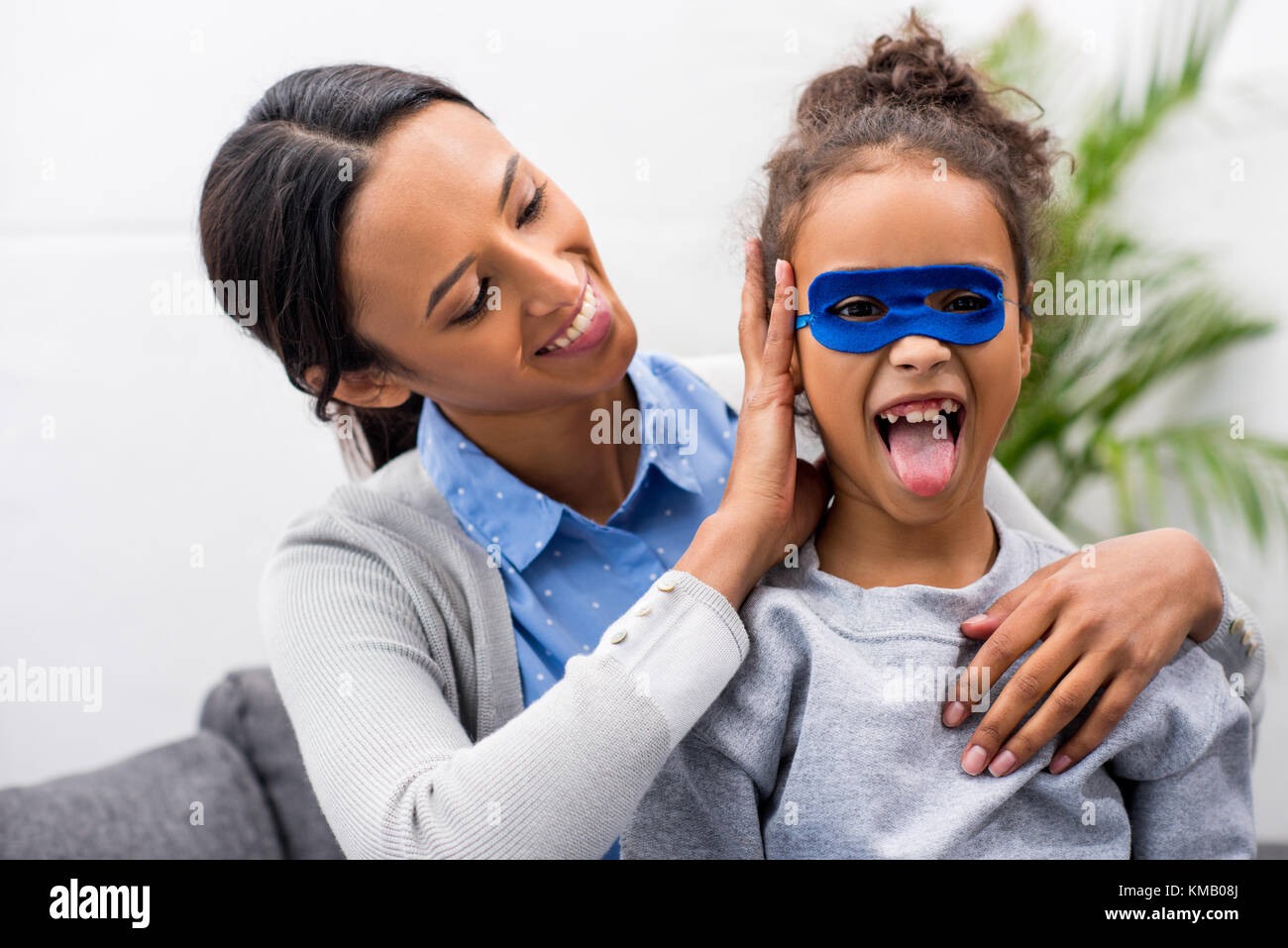 daughter in superhero mask  Stock Photo