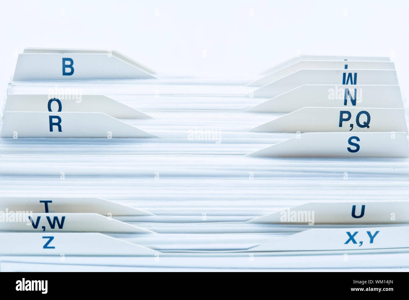 closeup of rolodex cards organized by alphabetical order Stock Photo