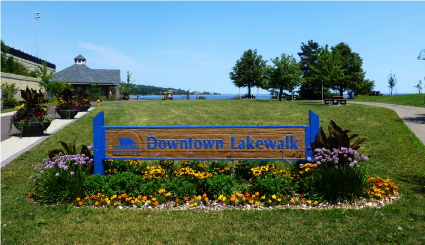 Downtown Lakewalk sign in summer bloom