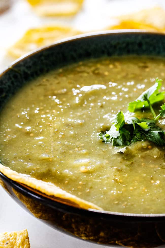 bowl of roasted salsa with cilantro garnish