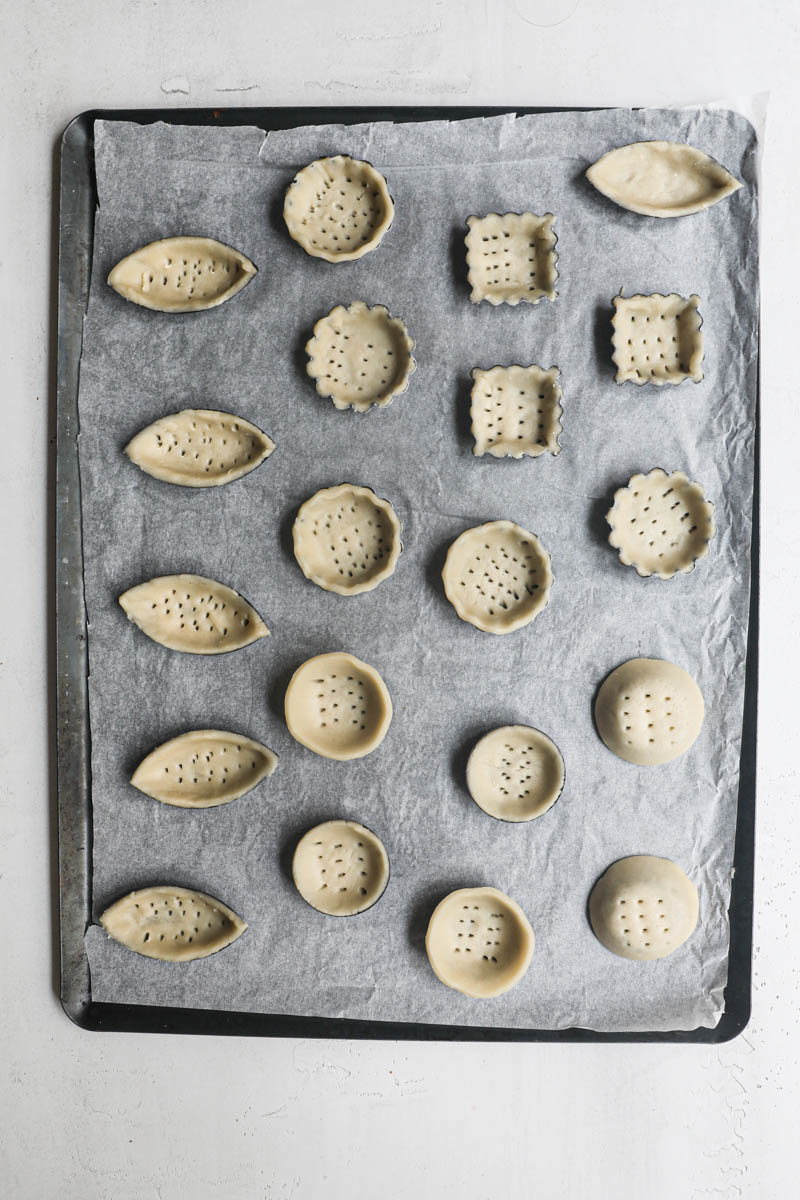 The lined mini tartlet pans ready for the oven.