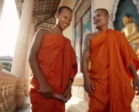 Monks conversing in a Buddist temple