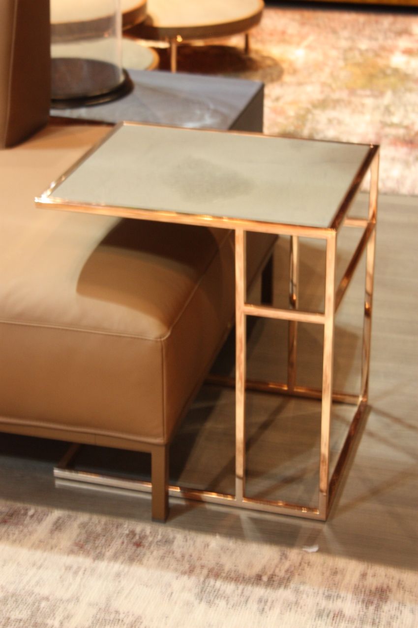 An eclectic mix of wood and metal balls come together in a compact but functional side table from Munna Design.