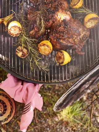 lamb cooking on charcoal bbq