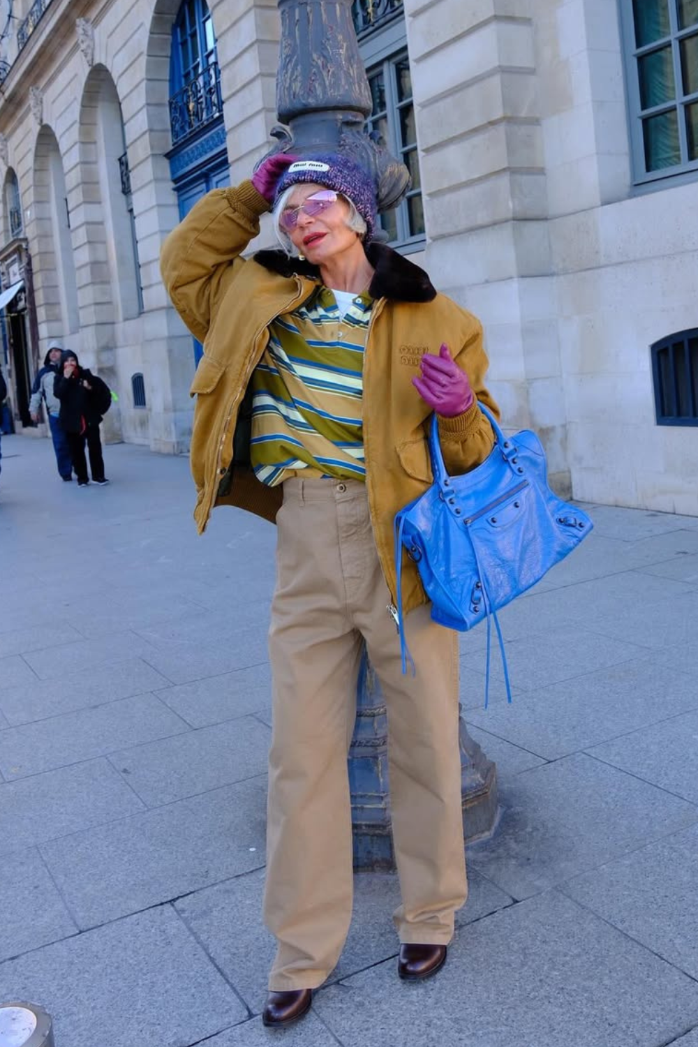 @greceghanem wears barn jacket, brown jeans and rugby shirt