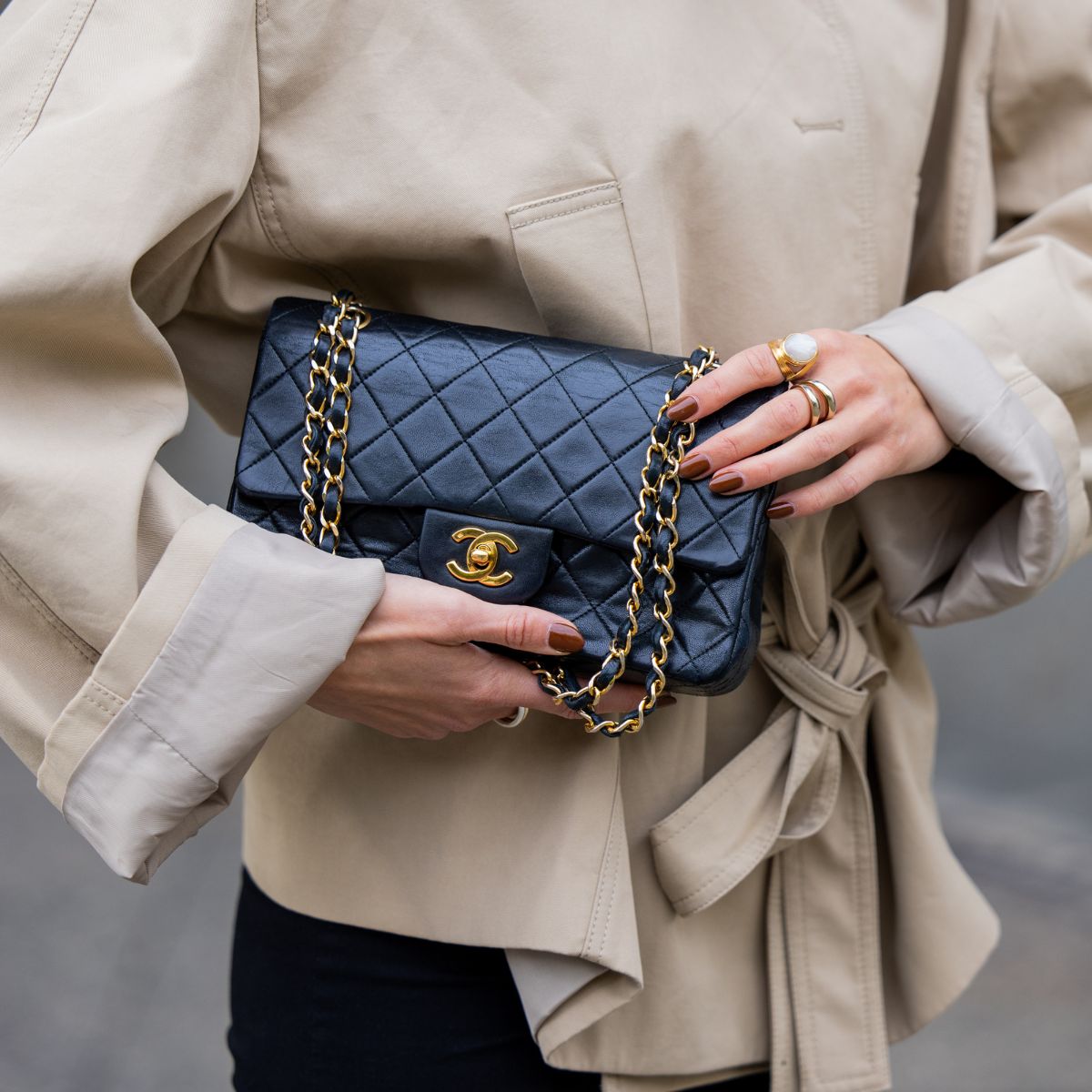 a woman carrying a chanel bag