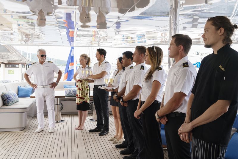 a captain speaks to his crew on a yacht in a still from Below Deck & Below Deck: Mediterranean