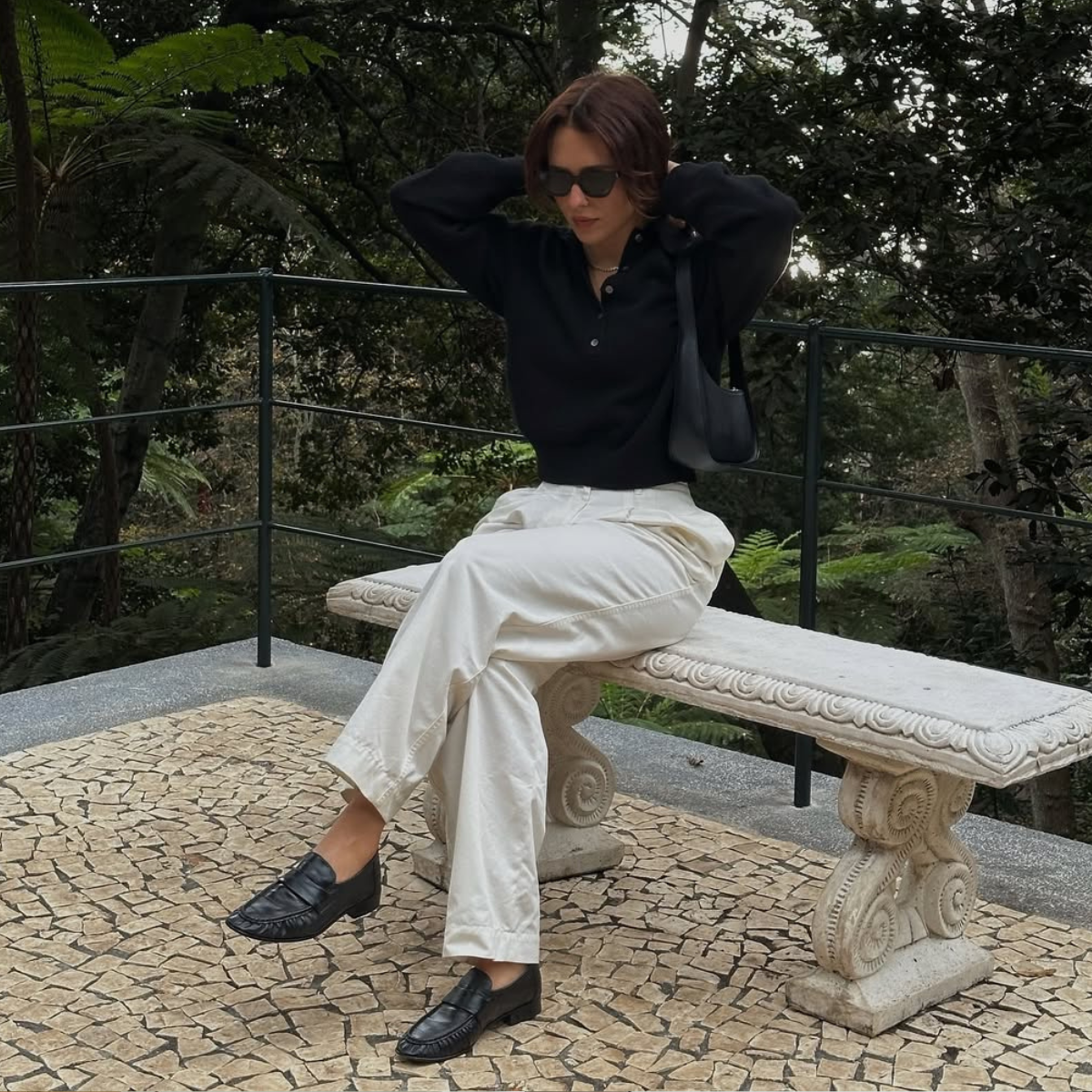 @deborabrosa wears cream trousers and black loafers