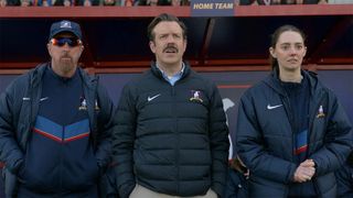 Coach Beard, Ted, and Alice looking at something from the touchline in Ted Lasso season 4 episode 8