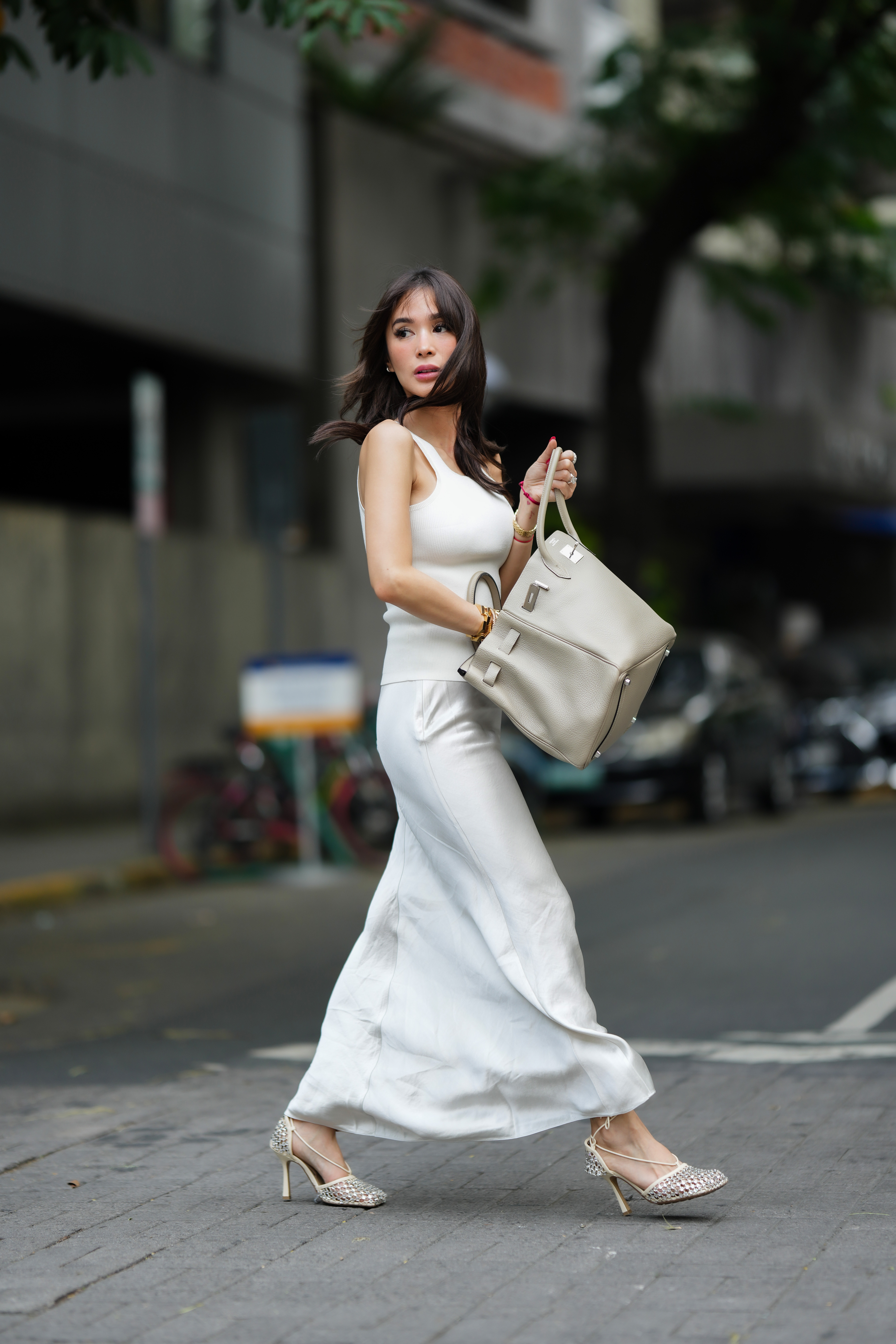 woman wearing white tank top and skirt