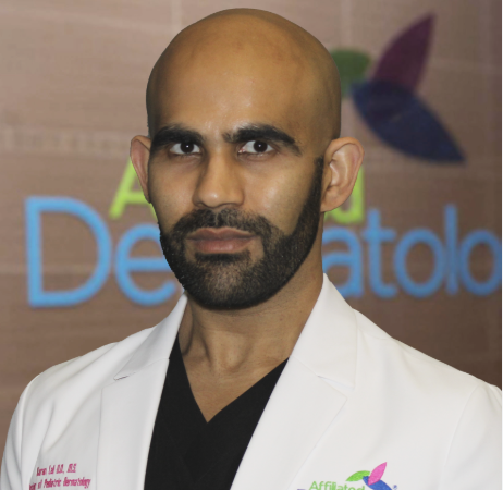 a man with a beard wearing a white lab coat