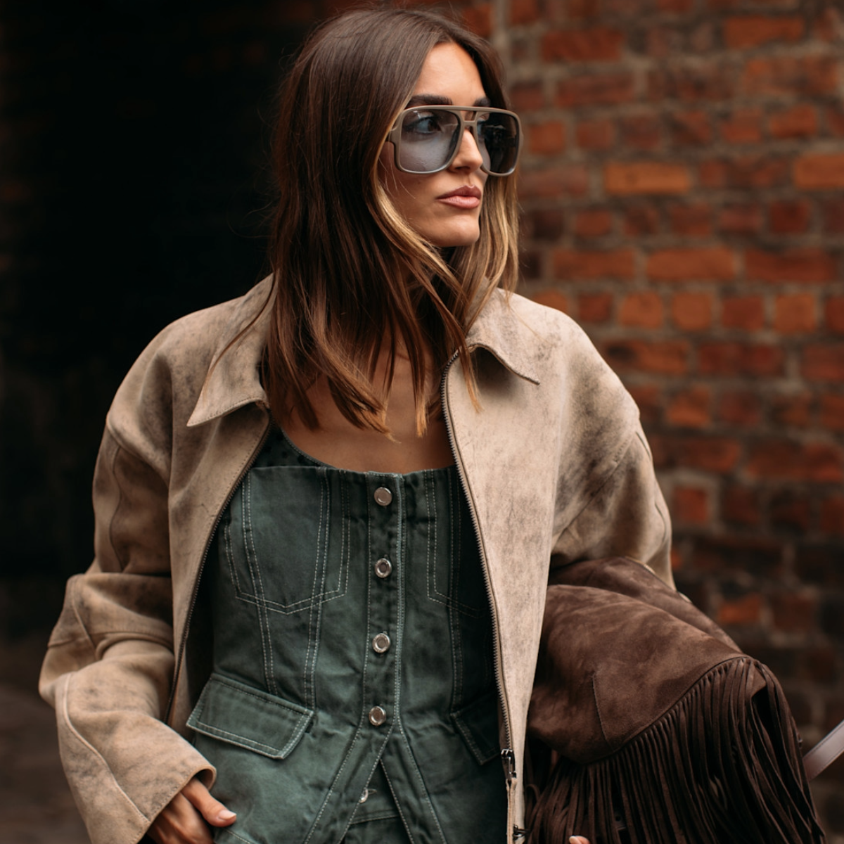 woman wearing a suede jacket 