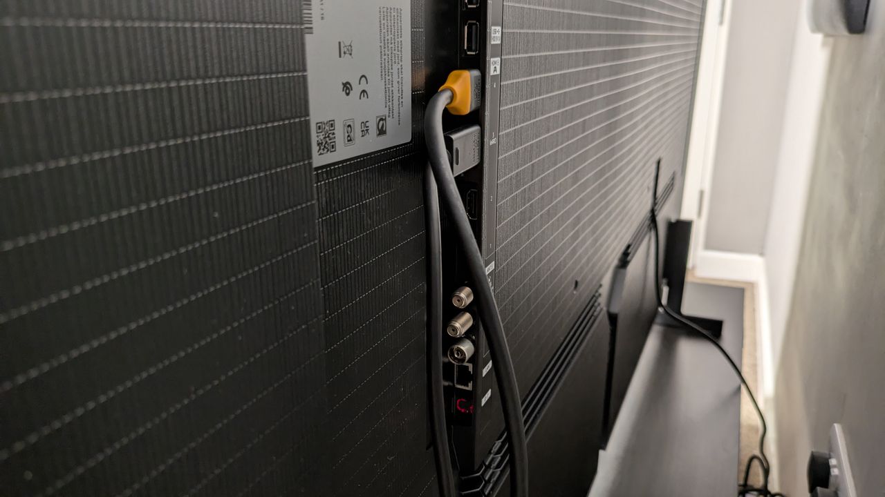 Samsung S99H ports on rear panel with two HDMI cables plugged in