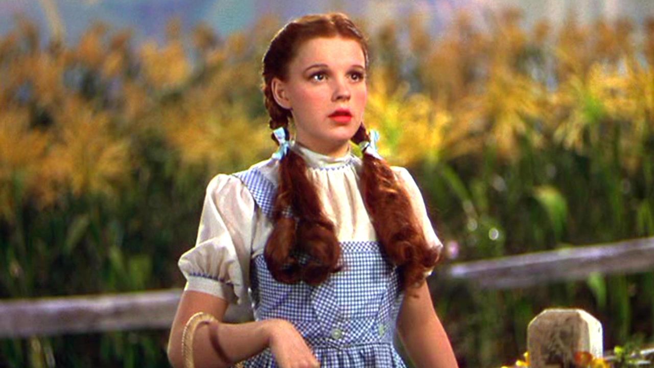 Judy Garland as dorothy walking through cornfields in &#039;The Wizard of Oz&#039;