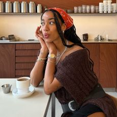 Amaka Hamelijnck posing at a cafe 