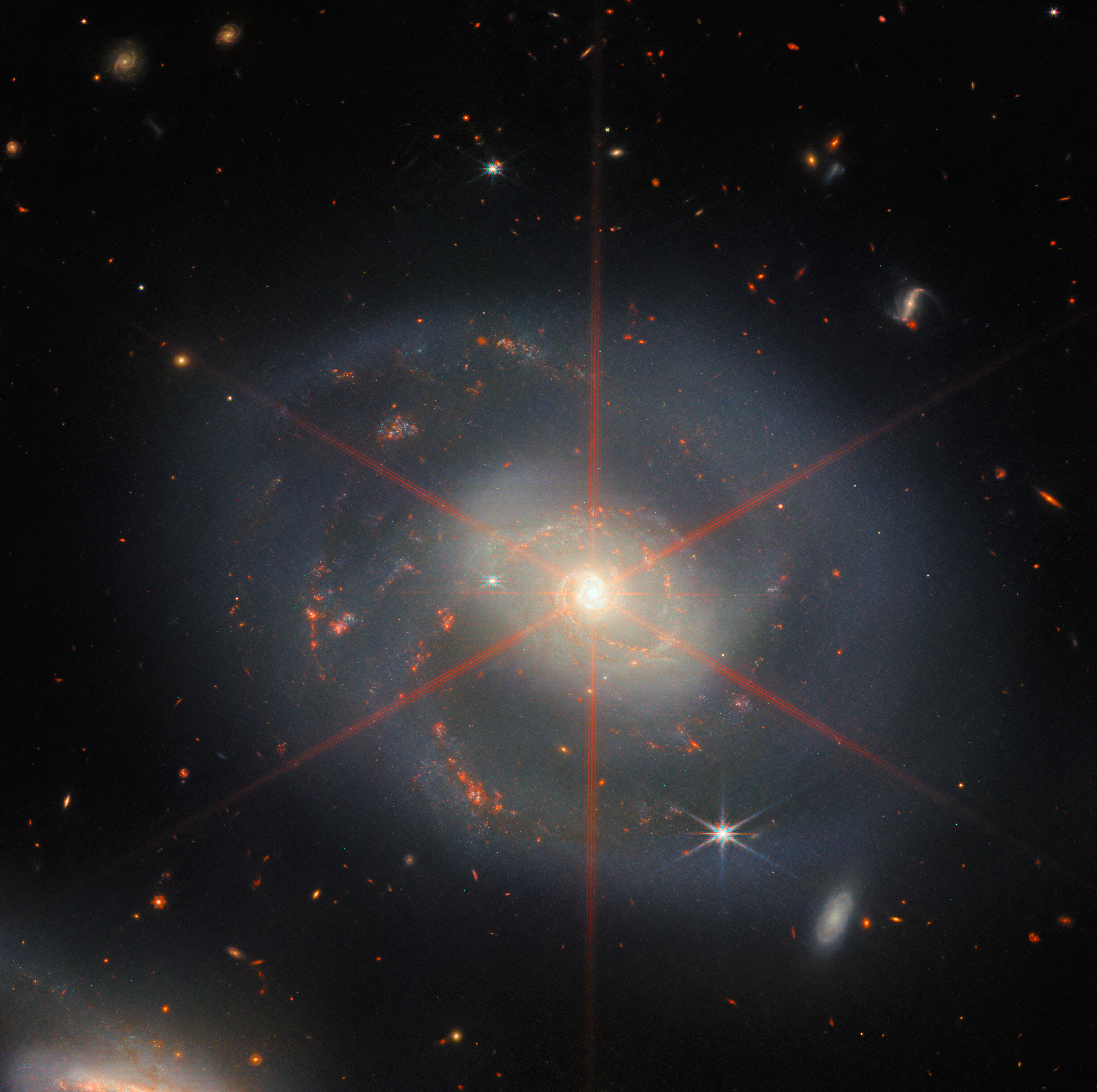 A glowing wreath of stars shines in this image of a spiral galaxy