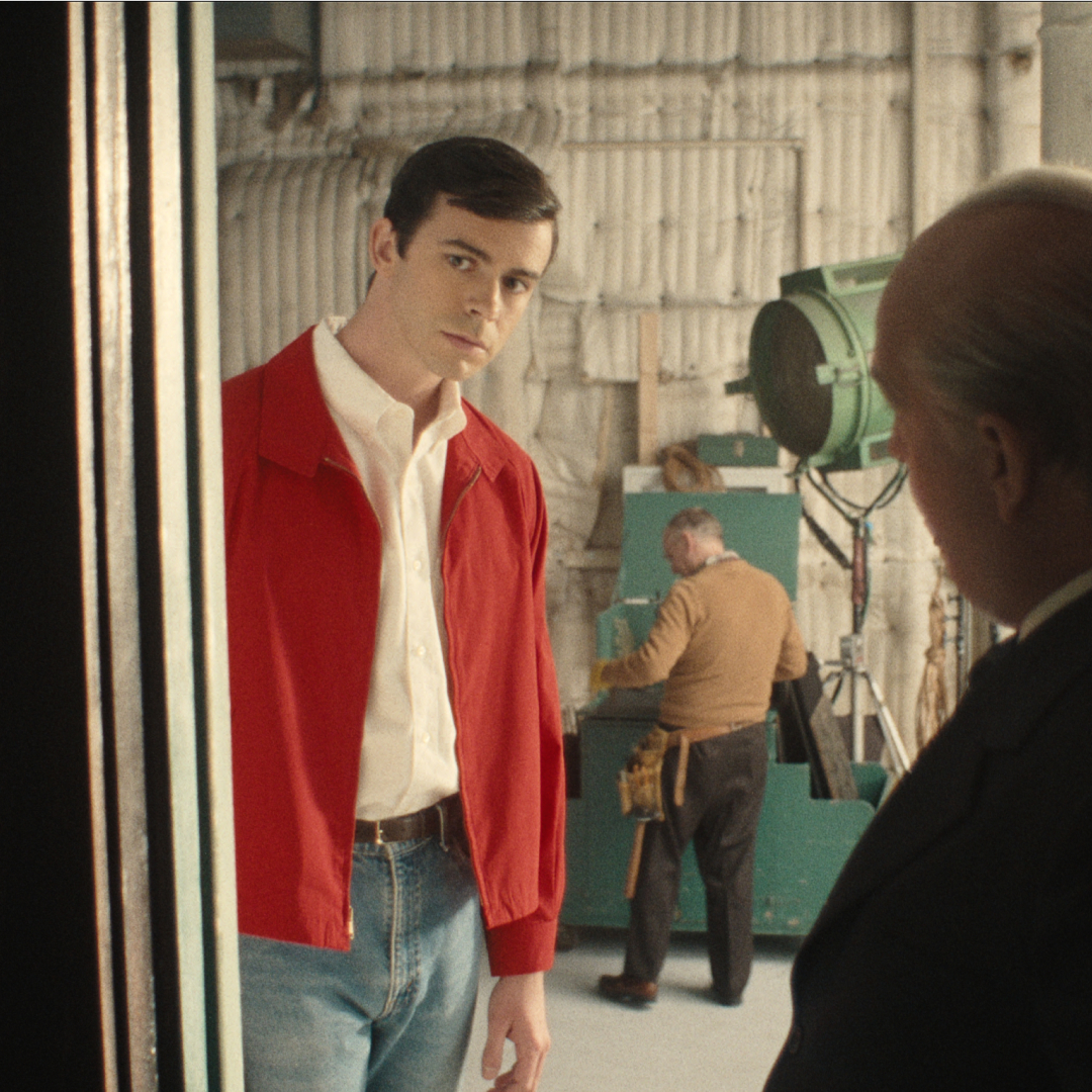 (L to R) Joey Pollari as Anthony Perkins, Tom Hollander as Alfred Hitchcock in episode 302 of Monster: The Ed Gein Story.