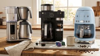 Three drip coffee makers on kitchen counter