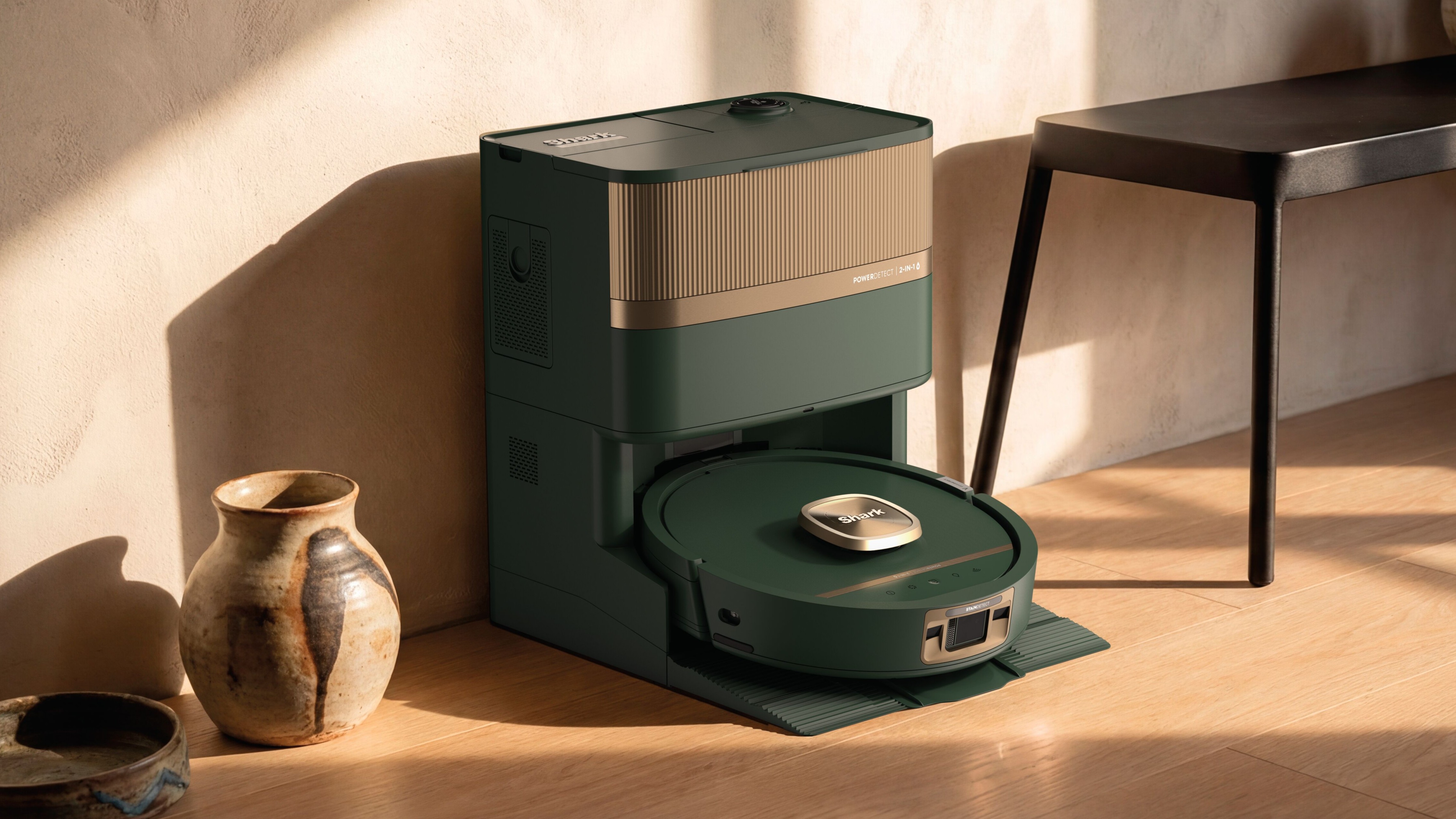 Shark PowerDetect UV Reveal 2-In-1 Vac &amp; Mop in green and bronze, in dock in hallway
