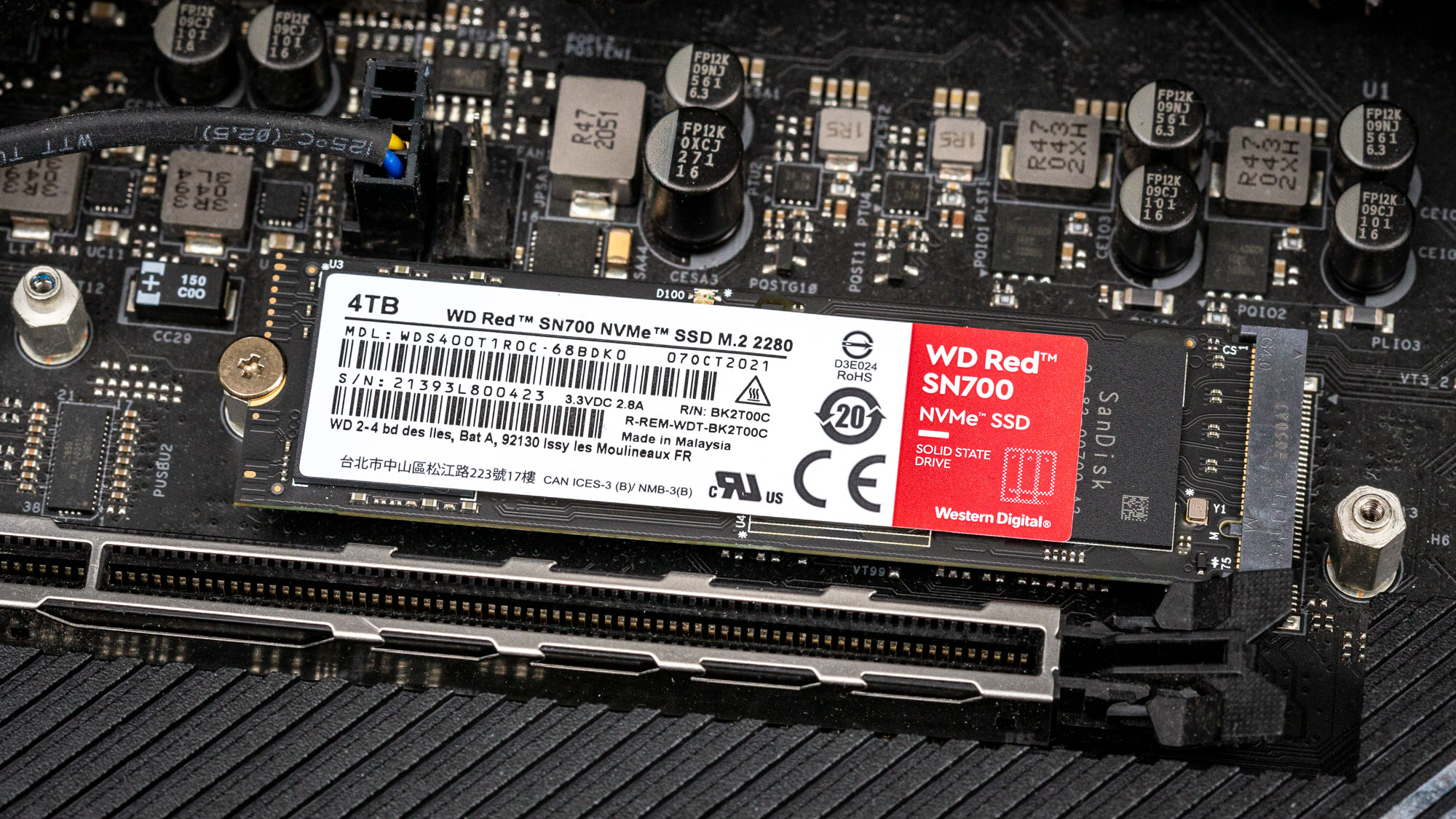 A Western Digital WD Red SN700 SSD in place in a PC motherboard