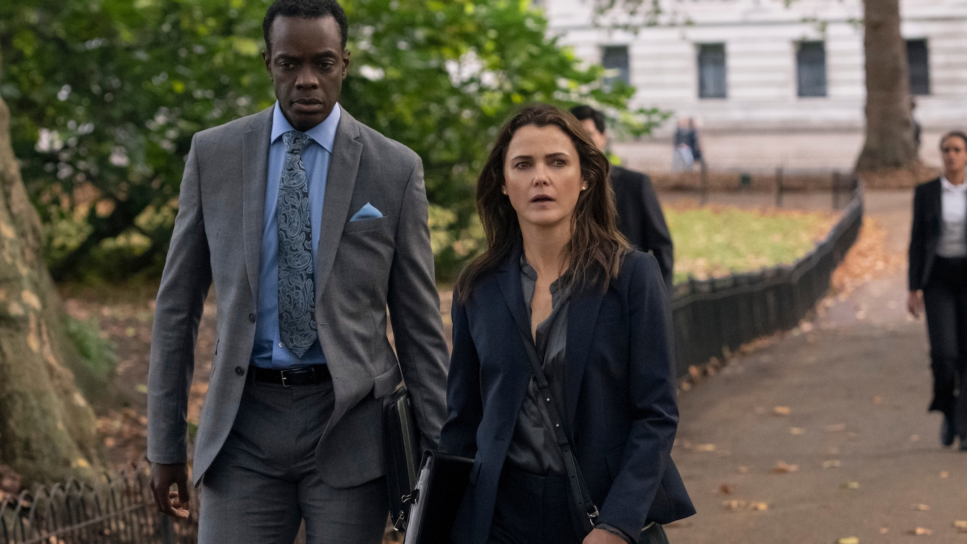 still from the diplomat season 1 of keri russell as kate wyler walking down a street in washington