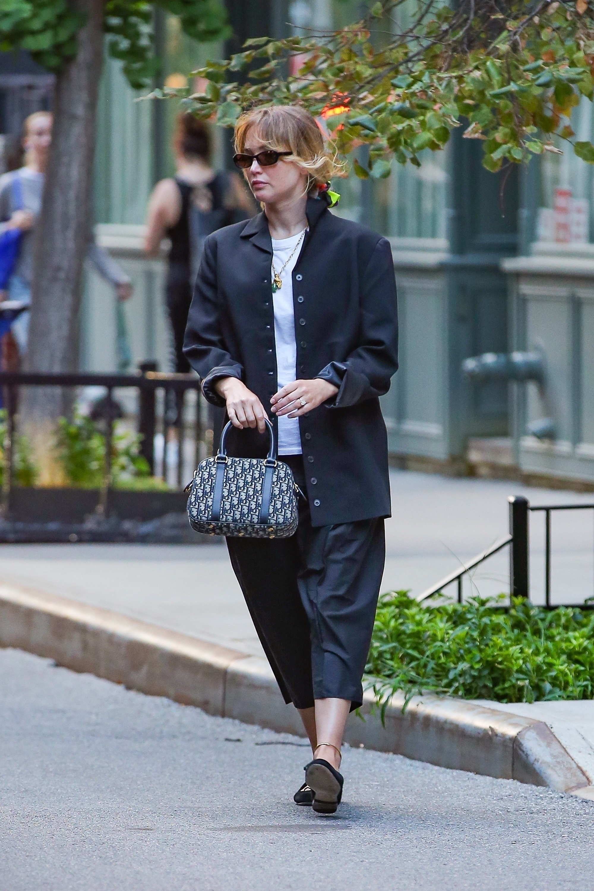 Jennifer Lawrence was spotted with a Dior bag in tow alongside flats and a satin skirt in New York City