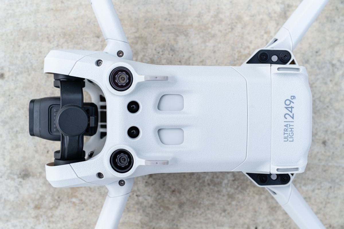 The DJI Mini 3 Pro drone resting on the ground