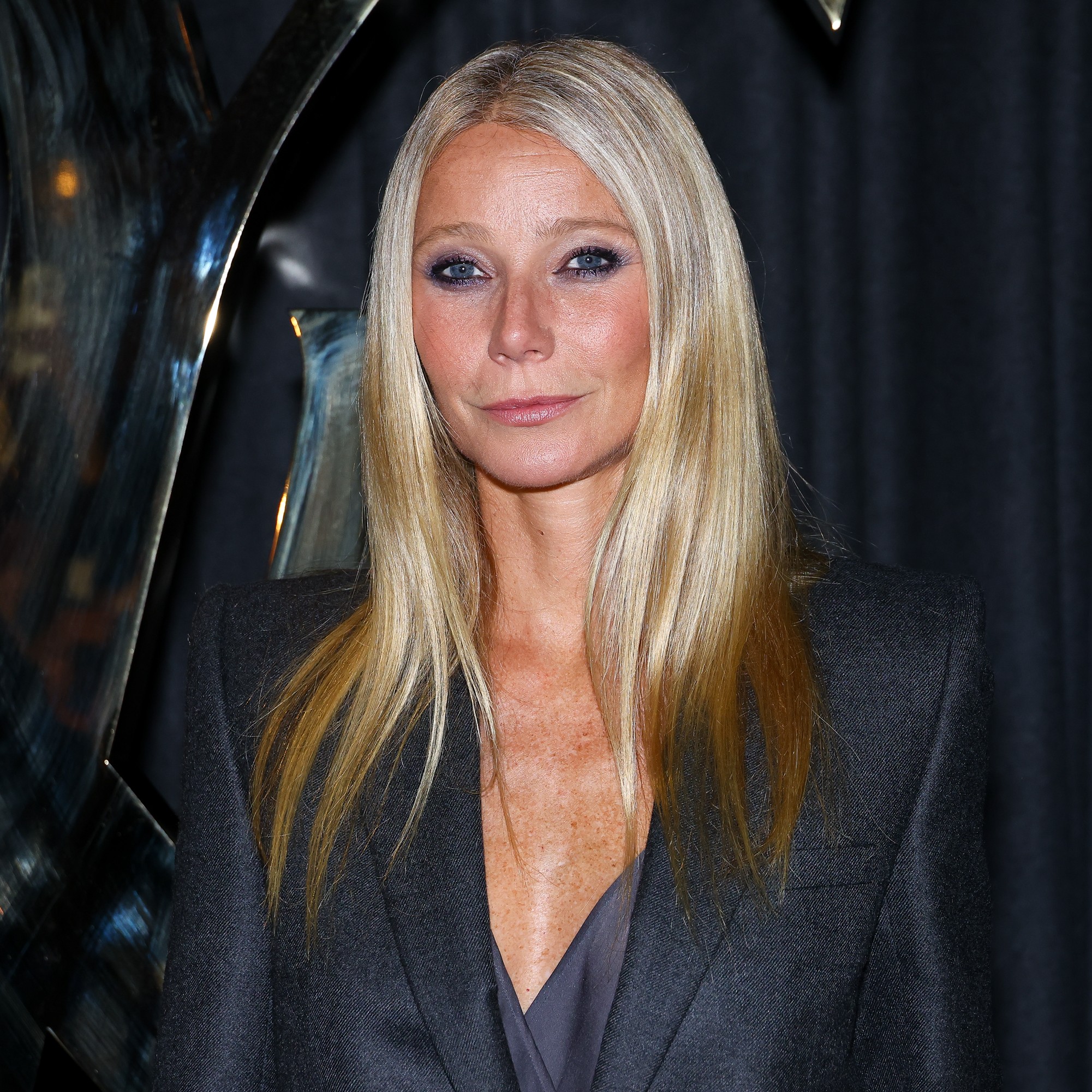Gwyneth Paltrow posing with her hair highlighted.
