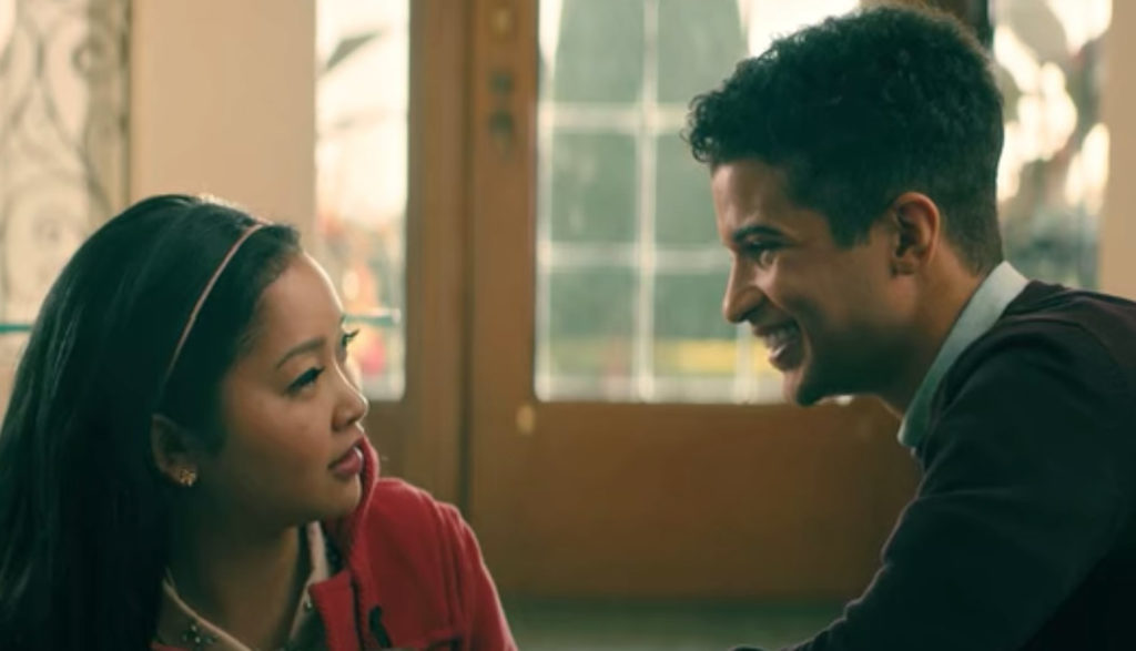 lana condor looks up at a boy in a school hallway in To All the Boys I&#039;ve Loved Before