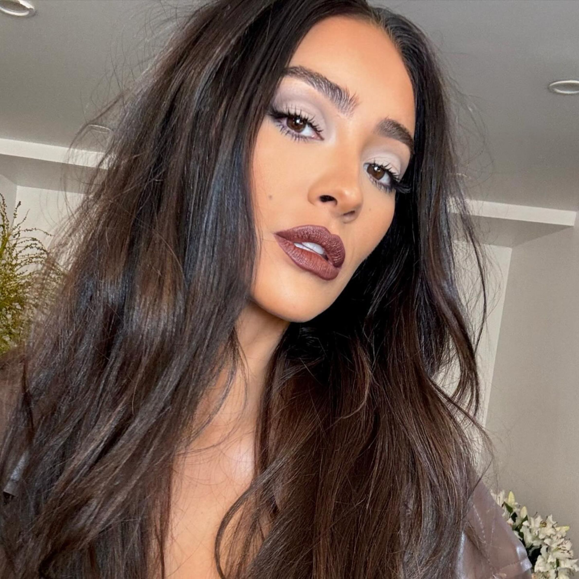 Shay Mitchell shows off her dark chocolate hair color.