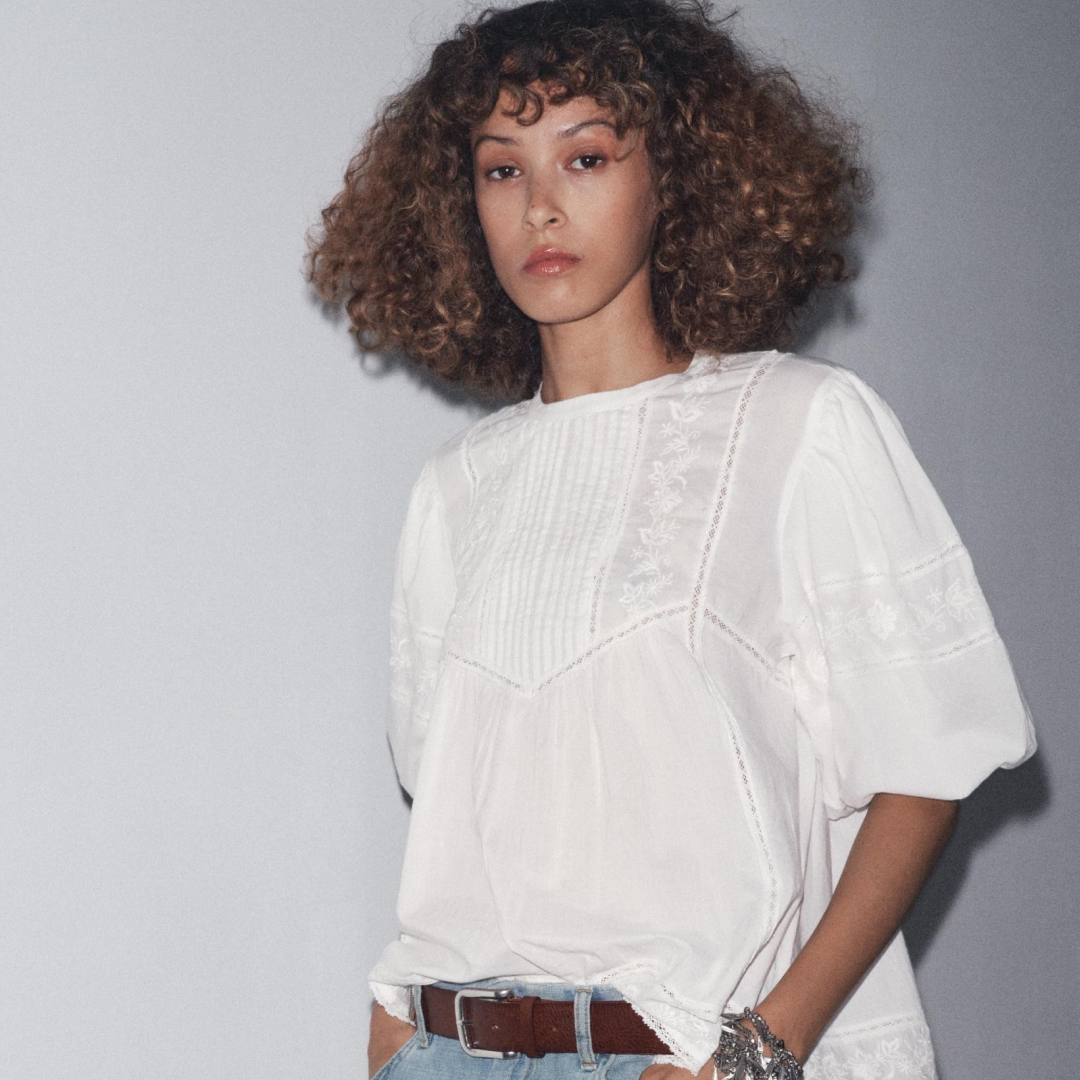 Zara model wearing the Zw Collection Embroidered Romantic Blouse on grey background