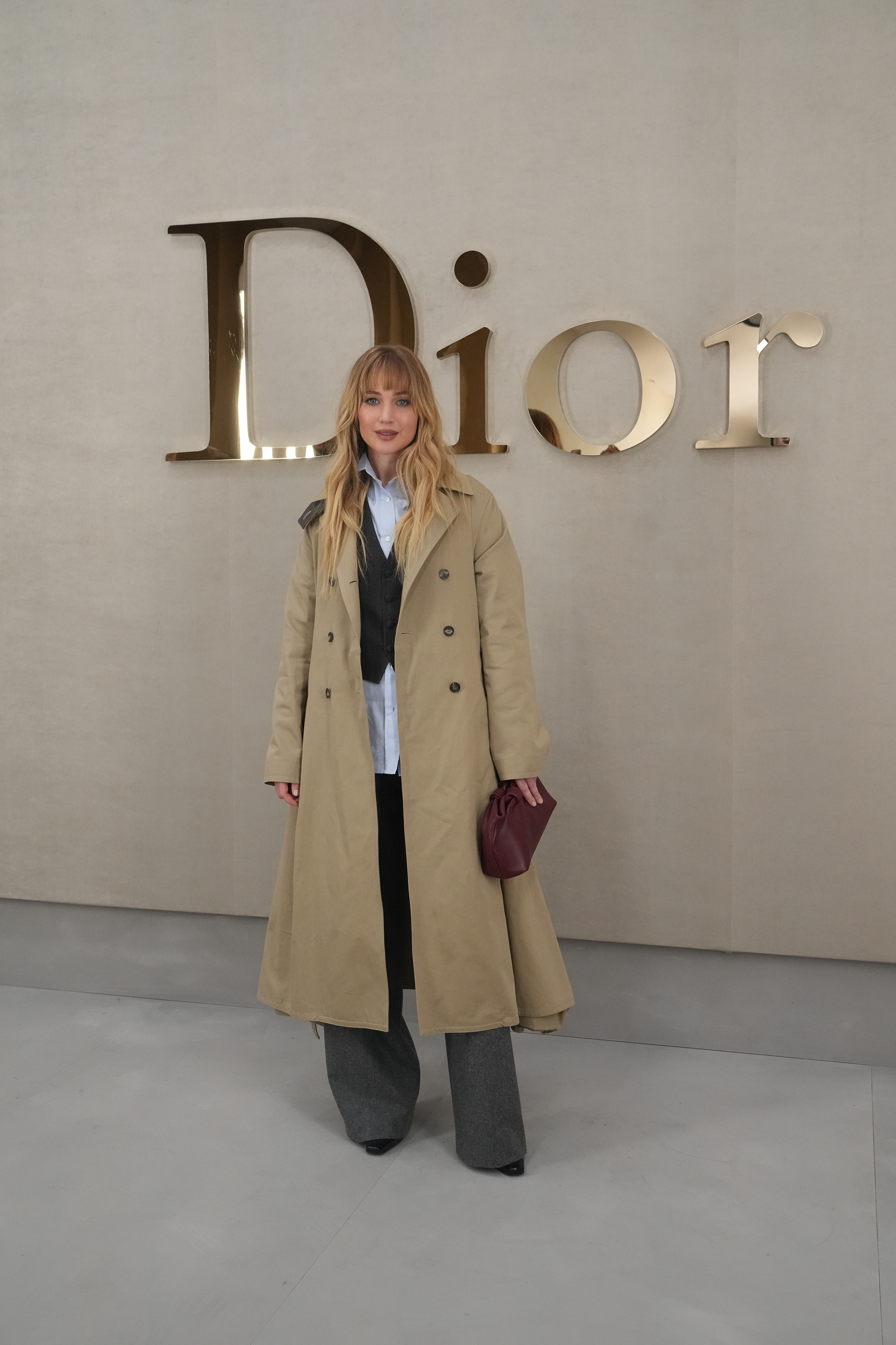 Jennifer Lawrence arrived at Dior by Jonathan Anderson's Spring 2026 show in a trench coat and pumps