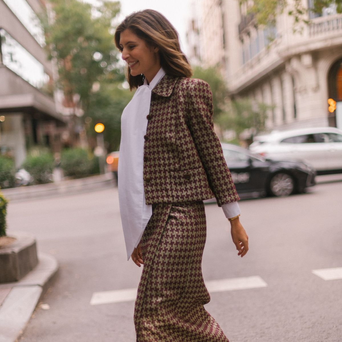 maria de la orden wears a houndstooth suit and white shirt