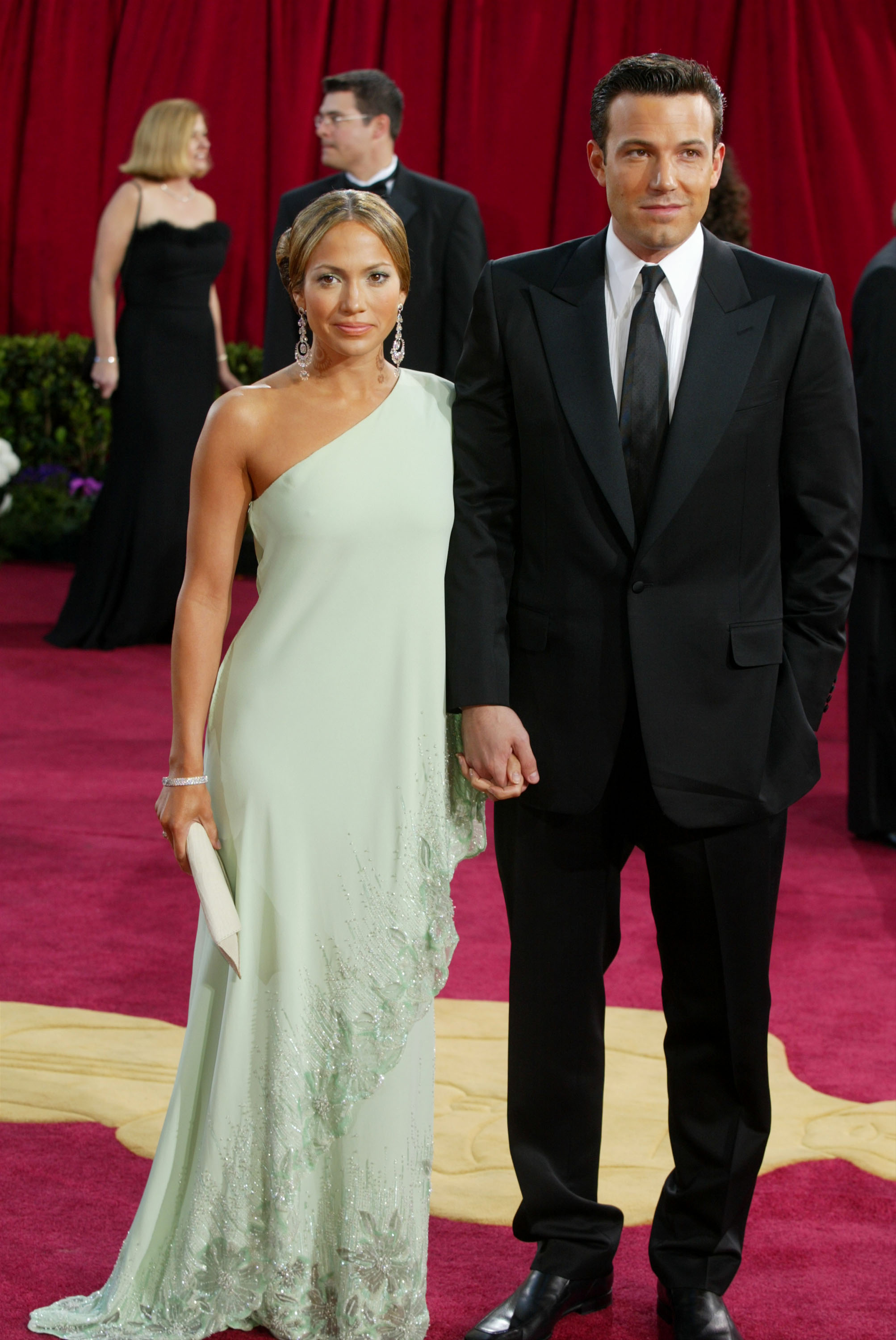 Actors Ben Affleck and fiancee Jennifer Lopez, wearing Harry Winston jewelry, attends the 75th Annual Academy Awards at the Kodak Theater on March 23, 2003 in Hollywood, California. (Photo by Kevin Winter/Getty Images)