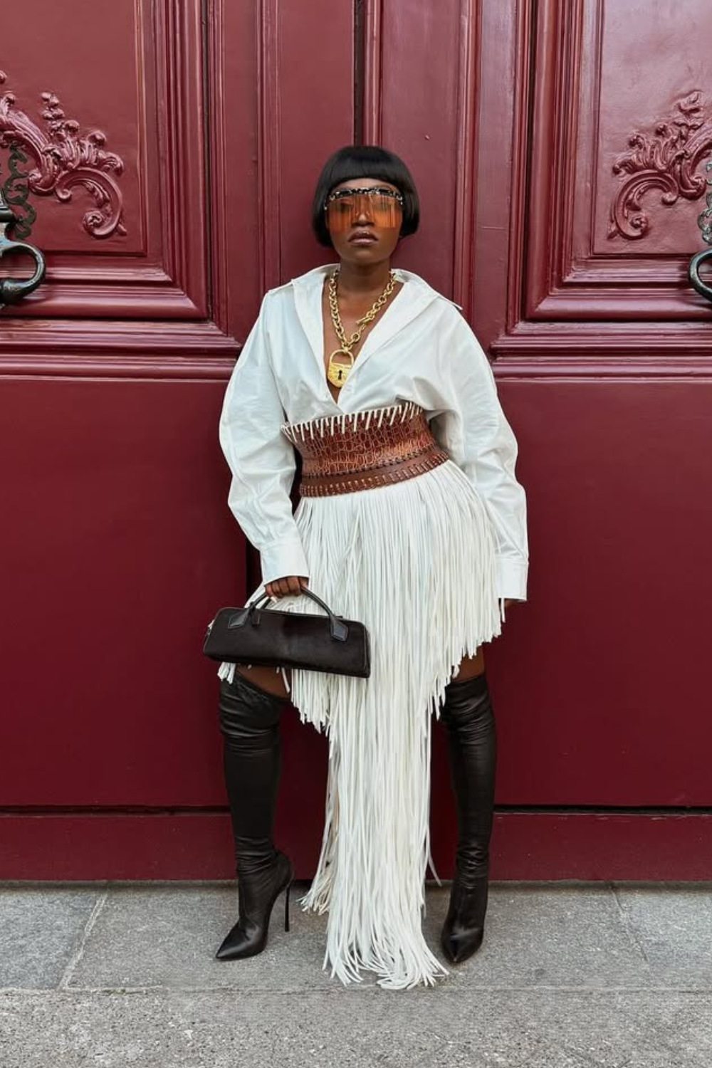 @fisayolonge wears white dress black over the knee boots