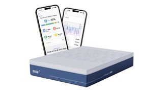 The OptomizeMe Smart Mattress on the floor, a render of two smartphones showing the OptimizeMe app in the background