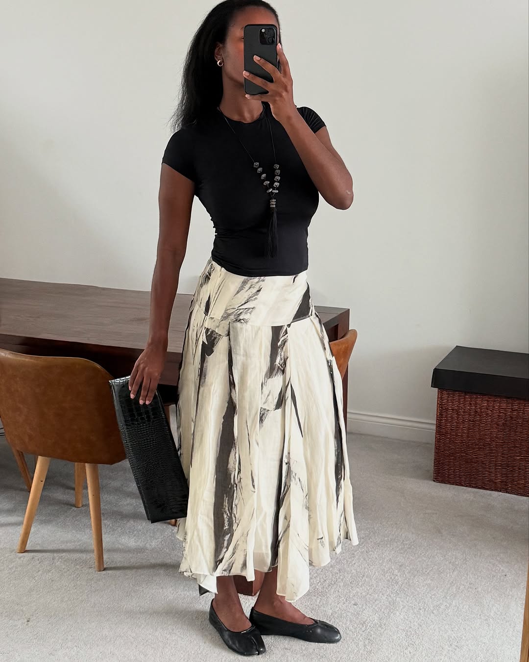 Woman wearing a drop-waist skirt.