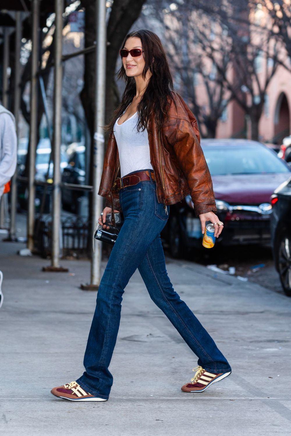 bella hadid wearing brown adidas sl 72 trainers
