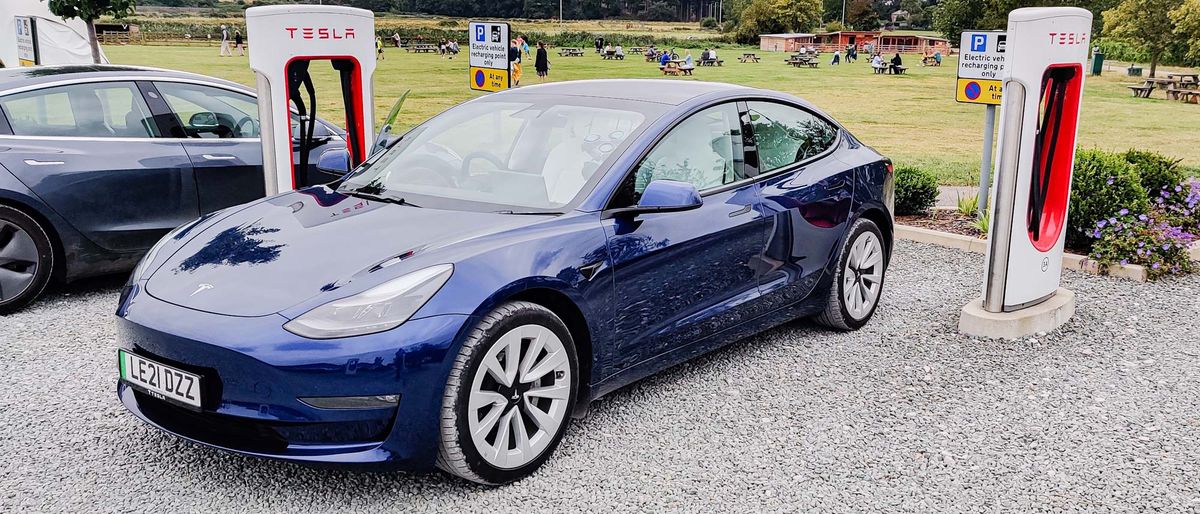 Tesla Model 3 parked in charging station