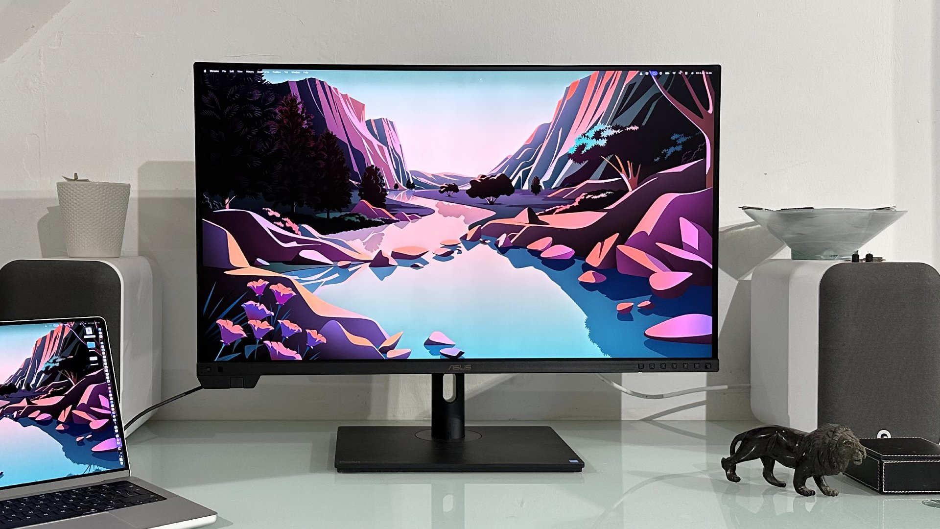 The Asus ProArt PA32KCX 8K monitor on a white desk in a home office during our review process