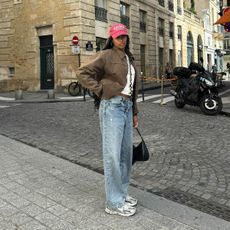 Woman wearing jeans and sneakers in Paris