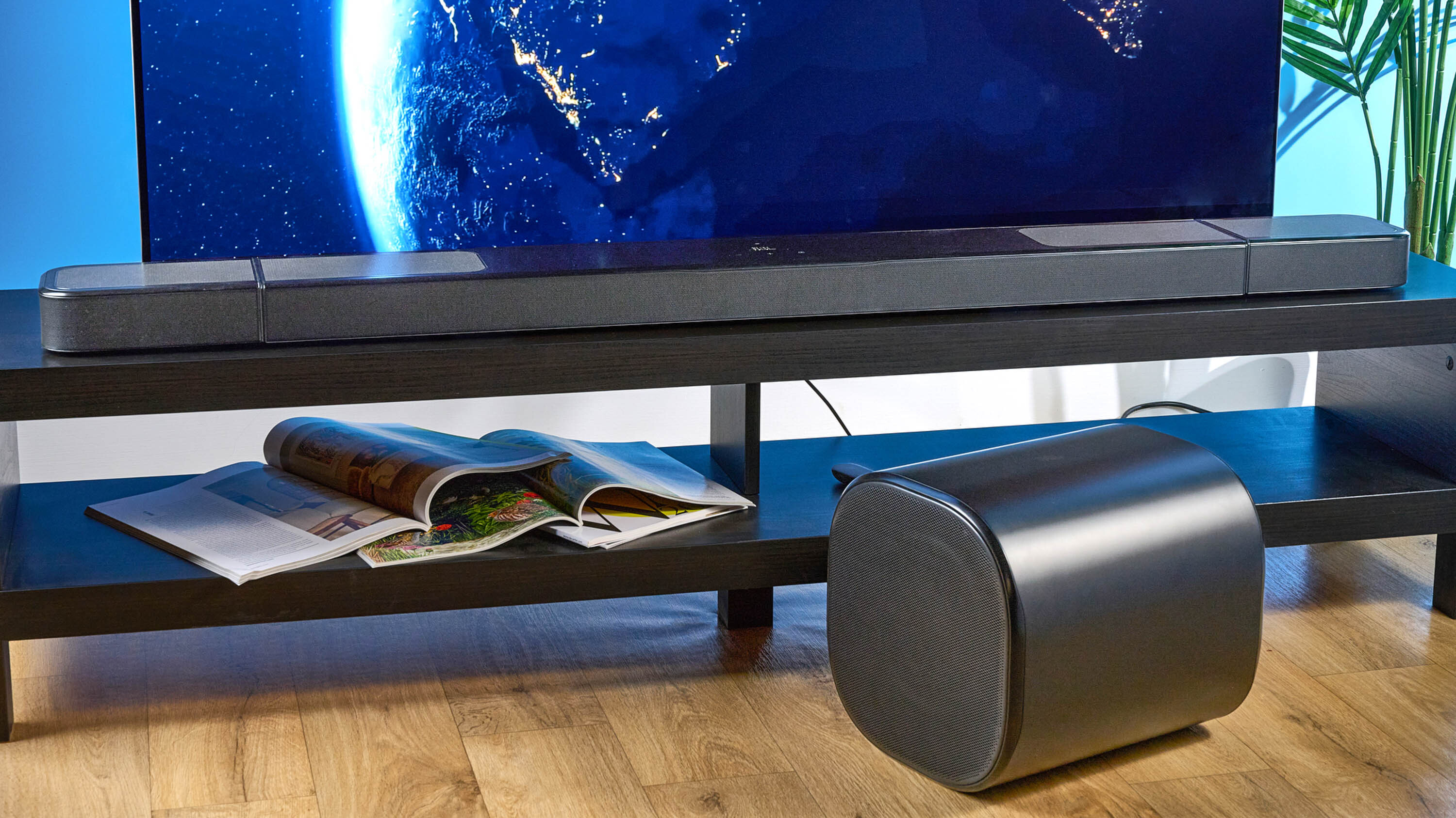 the jbl bar 1300xmk2 in black photographed against the blue tom's guide background