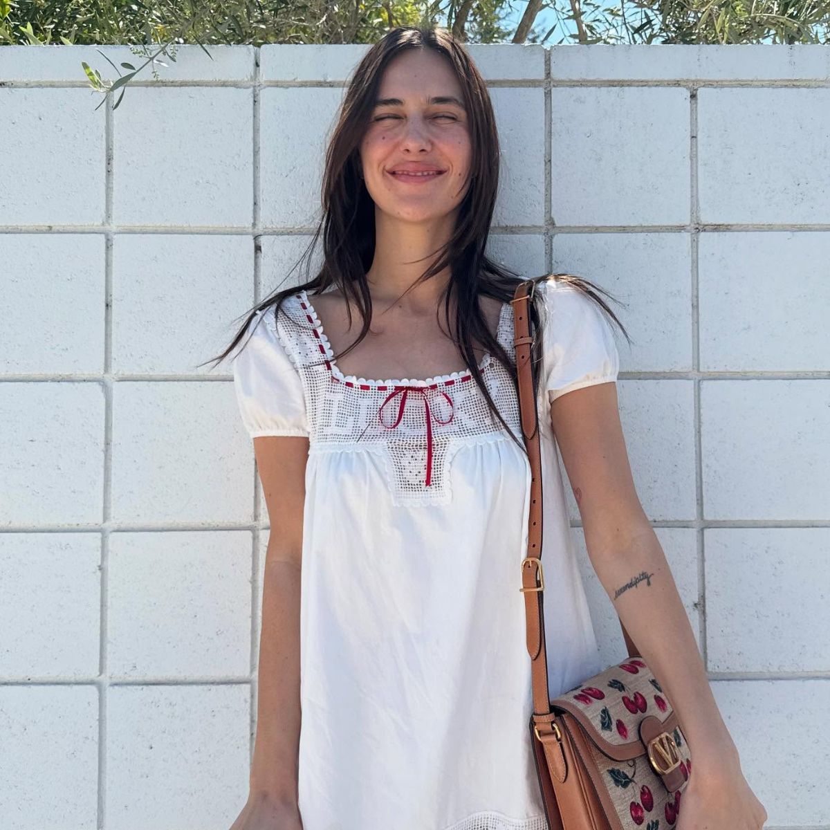 An image of @devonleecarlson wearing a music festival outfit. 