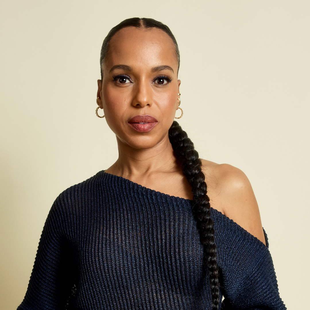 Kerry Washington in an asymmetrical top with a low braided ponytail hairstyle 