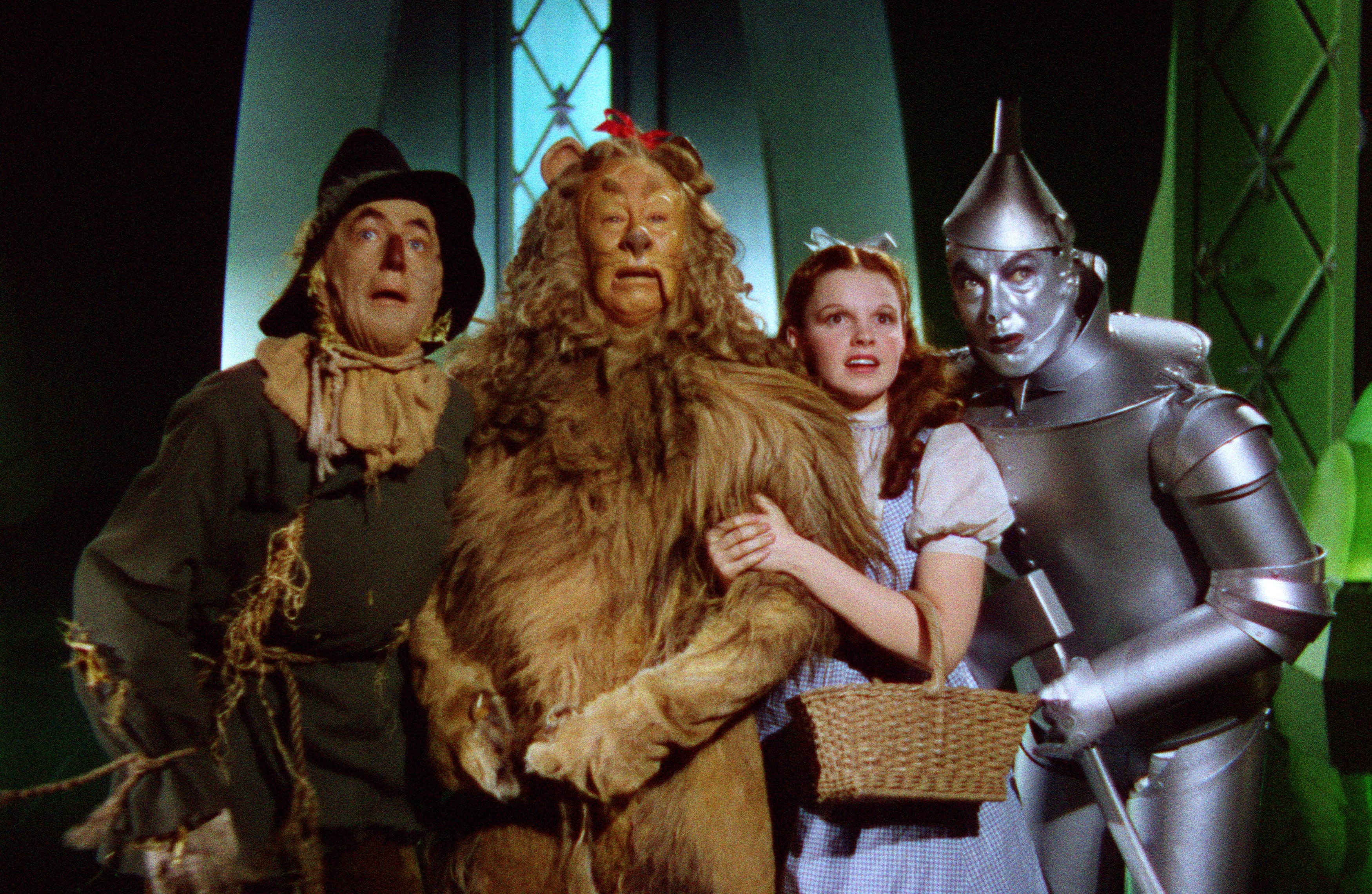 scarecrow lion dorothy and tinman as the arrive to see the wizard in the movie The Wizard of Oz