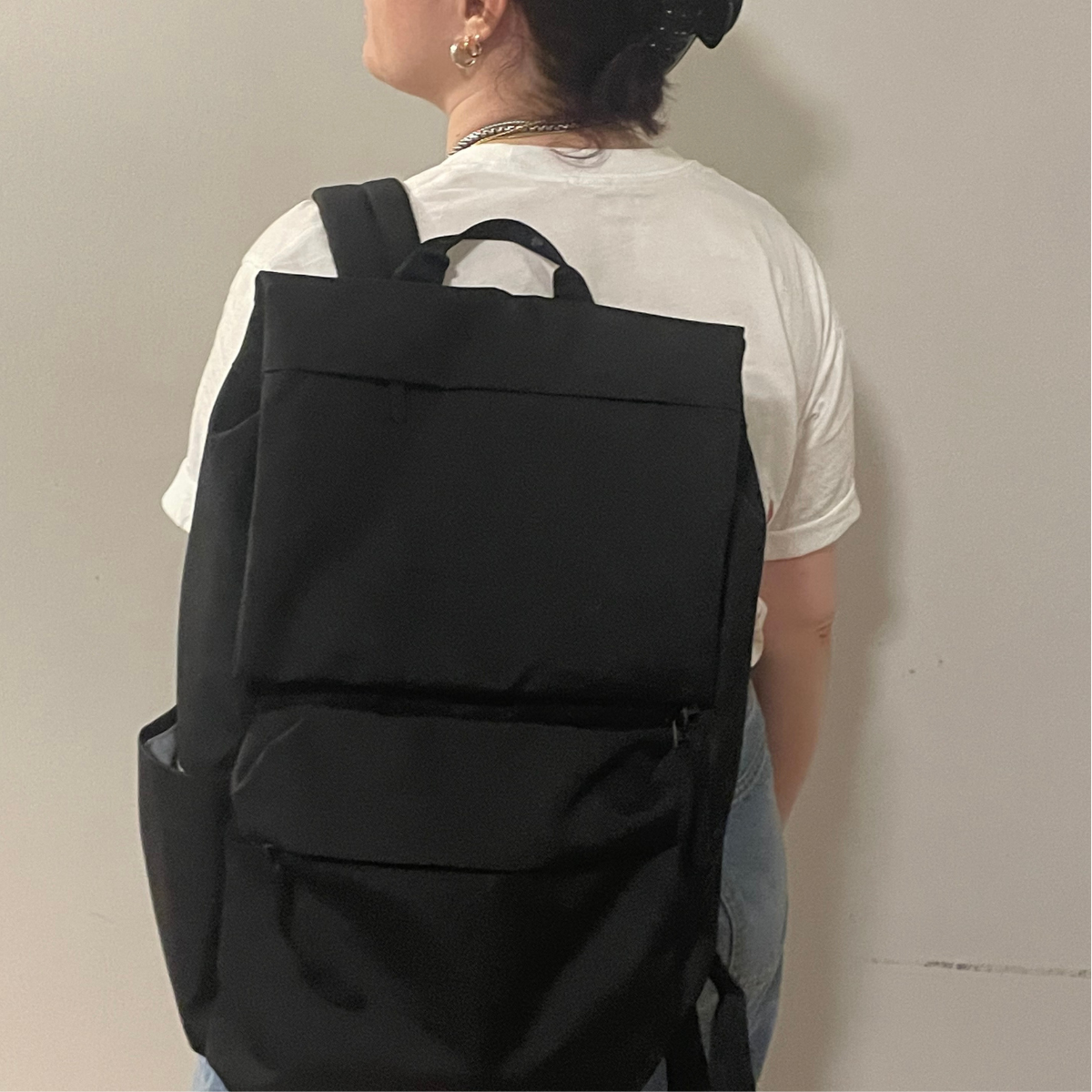 Associate Commerce Editor Brooke Knappenberger tests the Everlane Re-New Transit Backpack in black