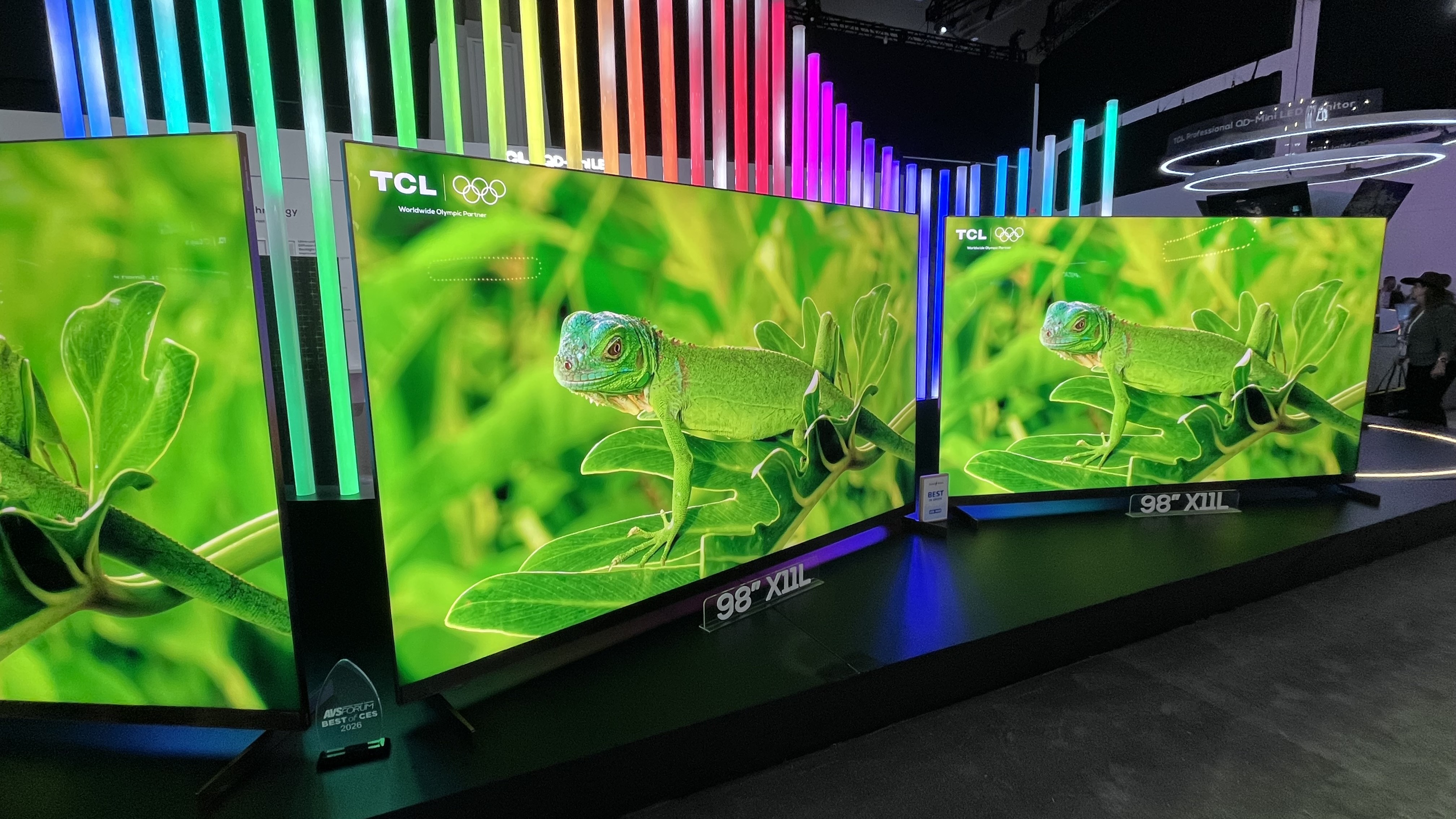 TCL X11L TVs showing green lizard on screen