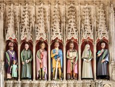 Fig 6: Rory Young’s rood-screen figures, consecrated in 2015, with St Alban in the centre, flanked by ancient and modern saints. St Albans Cathedral. ©Paul Highnam for Country Life